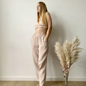 Model wearing a sleeveless organic muslin co-ord set for women with elastic crop top and wide-leg pants in lightweight cotton fabric