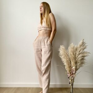 Model wearing a sleeveless organic muslin co-ord set for women with elastic crop top and wide-leg pants in lightweight cotton fabric