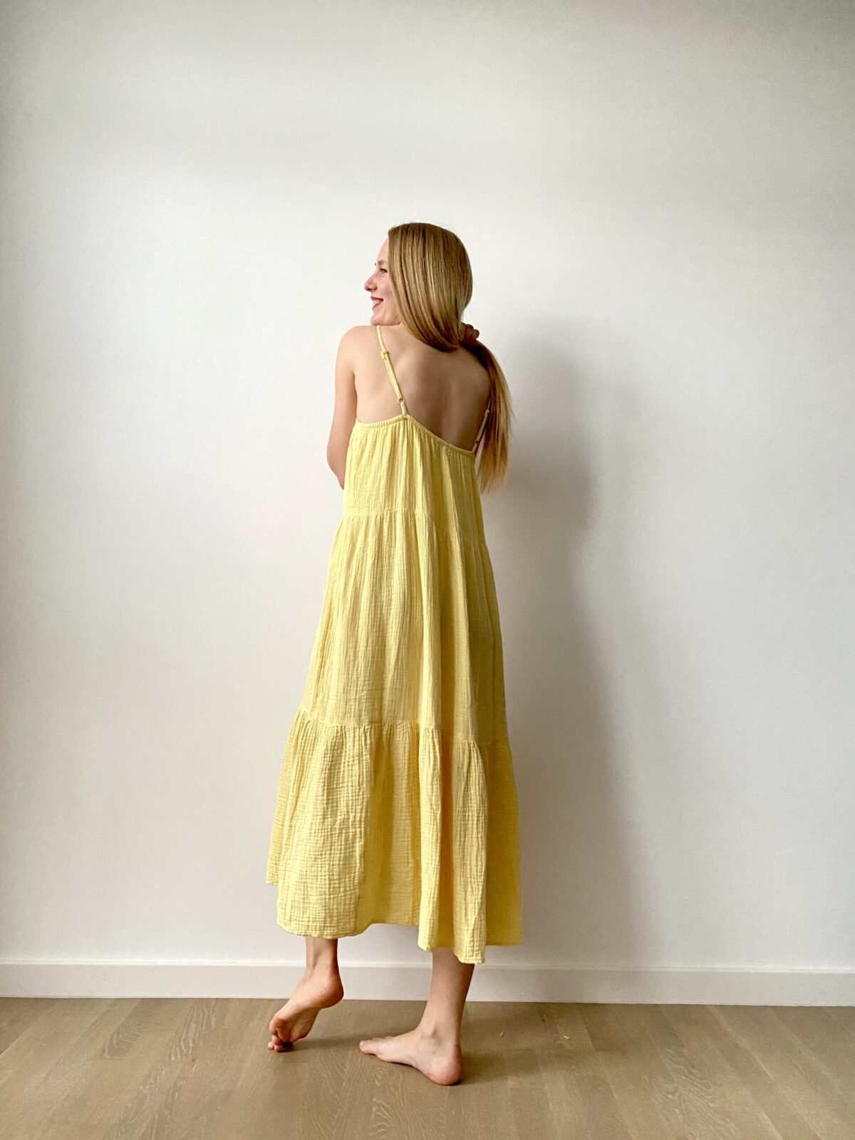 organic cotton midi women’s dress with flowing design and shoulder straps, ideal for warm weather and casual chic looks.