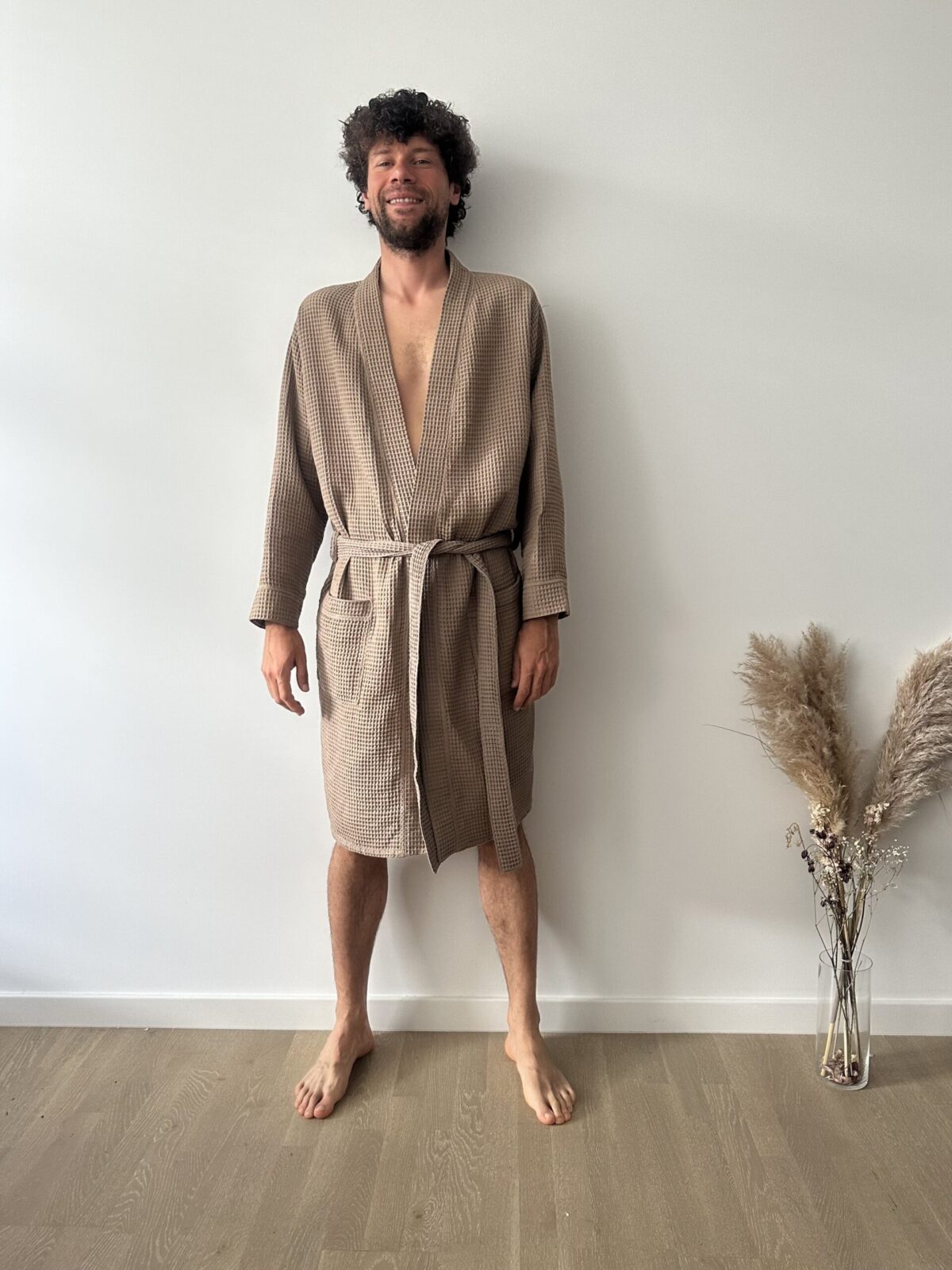 Men’s waffle cotton bathrobe with waist tie and deep pockets, breathable and perfect for lounging or spa use.