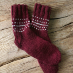 Deep red adult wool socks with white Nordic-style knit pattern, hand-knitted from natural wool