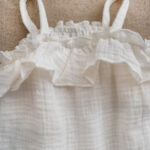 Handmade sustainable baby girl's muslin romper