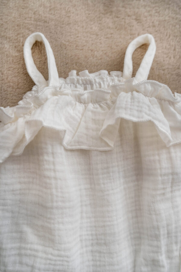 Handmade sustainable baby girl's muslin romper