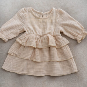 Baby girl muslin dress with long sleeves and ruffle layers