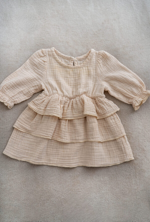 Baby girl muslin dress with long sleeves and ruffle layers