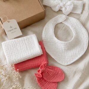 Muslin baby girl gift set with bib, bow headband, mittens and coordinating baby essentials